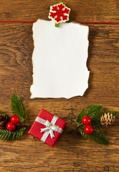 blank note with christmas decoration on wooden background 