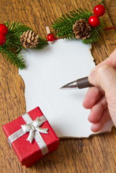 blank note with christmas decoration on wooden background 