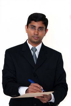 An indian businessman signing a business deal