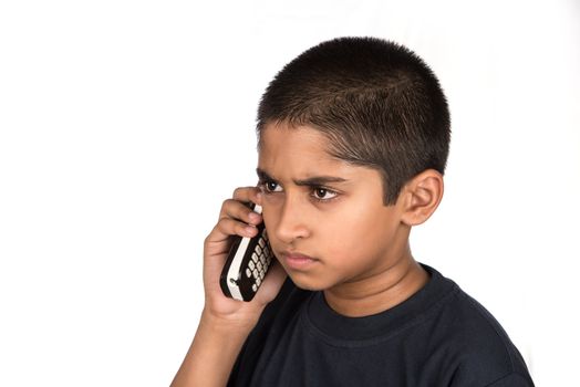Handsome Indian kid looking very mad talking on phone