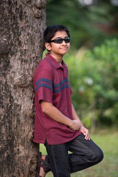 Handsome Indian toddler standing outdoor smiling