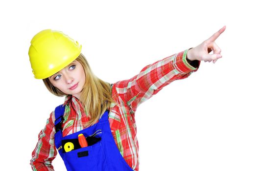 Female worker pointing up and looking at camera isolated on white background