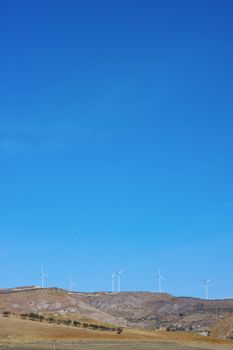 Wind mills on mountain tops in Sicily