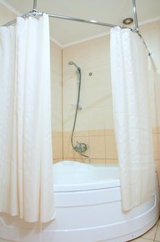 Bathroom with shower and curtains