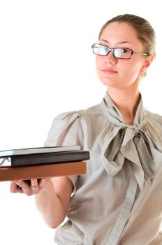 Intelligent serious woman in glasses with books isolated on white background