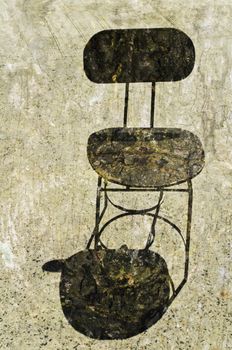 Grunge textured chair on concrete during a hot day