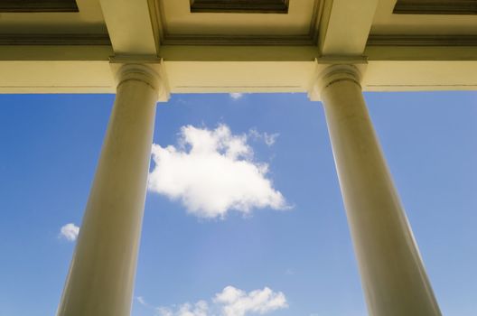 Worms eye view of school building columns shot against blue sky