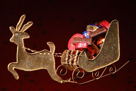 sweets on golden sleigh of Santa Claus