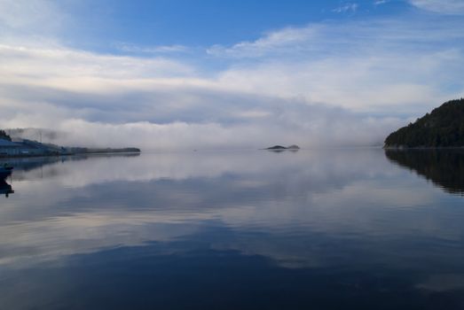 picture is shot from halden harbor and shows that the fog is thick out at the bay but has relieved innermost of the harbor, image is shot in september 2012