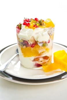 Varieties of fruits and nut with Greek yogurt [Orange,Peach,Pomegranate,Dragon fruit ]