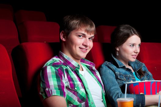 couple in a movie theater, watching a movie