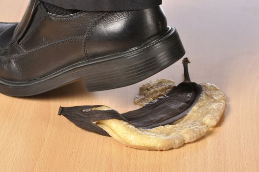 Heel of black shoe after stepping on over ripe banana