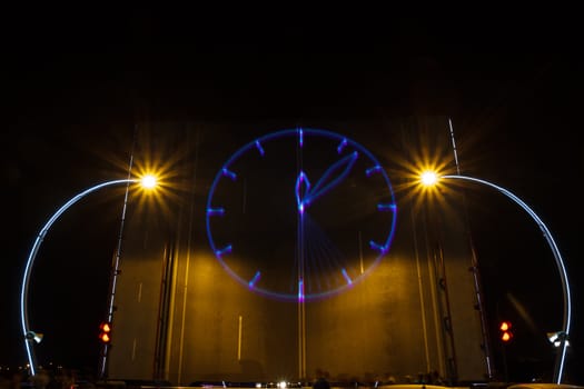 laser a projected clock on a drawbridge stage. new year concept