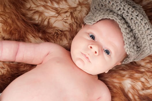 Shot of newborn baby lying on fur
