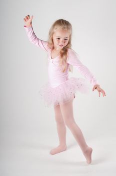 Studio shot of ballet dancer girl in pink