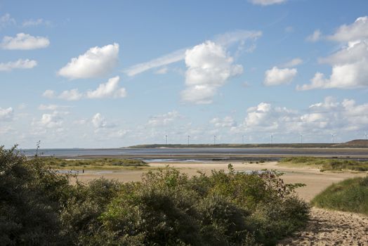 landscape with windmills in Holland near Rotterdam harbor