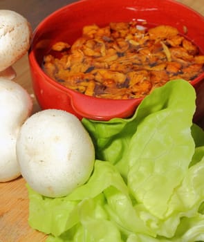 natural ingredients - white and yellow mushrooms and green salad