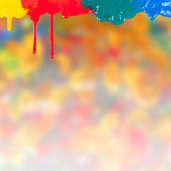 Abstract paints dripping on colorful background