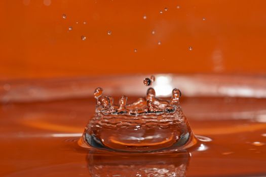 a water splash isolated on orange background
