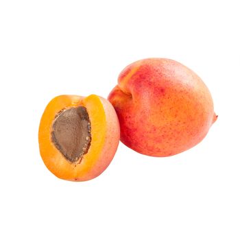 Whole and half ripe apricot fruits isolated on white background