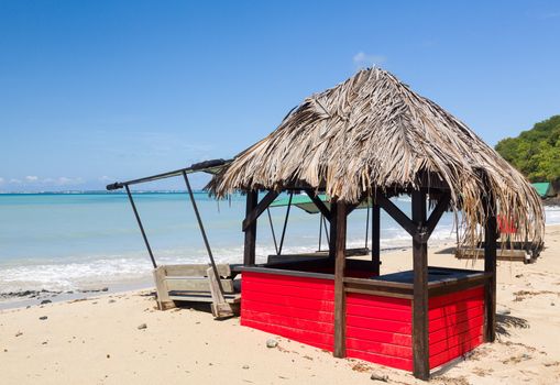 Sand swamps and buries table and chairs at bar on Friar's beach St Martin Sint Maarten