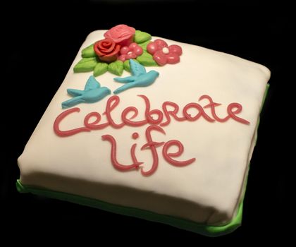 celebrate life cake on black background