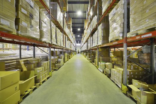 Indoor warehouse with lot of pallet. Wide angle photo.