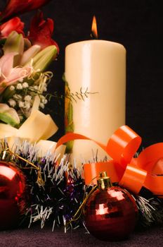 Christmas baubles with flower and candle 