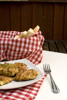 Fresh baked potato pancakes in white plate