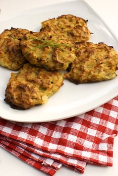 Fresh baked potato pancakes in white plate