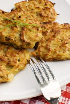 Fresh baked potato pancakes in white plate