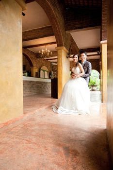 Happiness and romantic newlywed couples in italian style building for wedding background