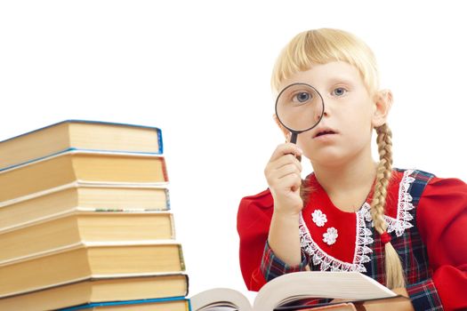 little girl reading with loupe