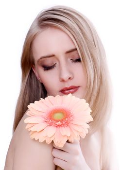Skincare of young beautiful woman face with flower against white background.