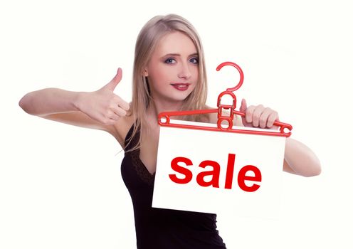 Young woman holding a sale sign, isolated on white