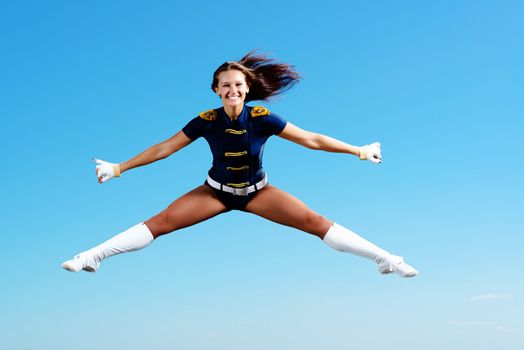 dancer jumping on a background of blue sky