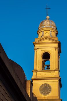 Steeple of beautiful yellow Catholic Church in Montevideo, Uruguay