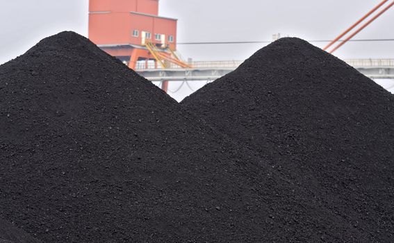 stock of raw coal in a river port