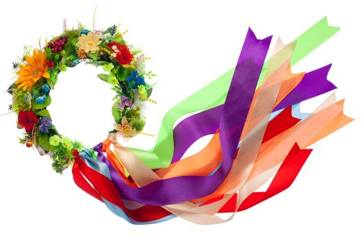 Traditional wreath with flowers and many-colored satin ribbons as a symbol of National Ukrainian folk costume isolated