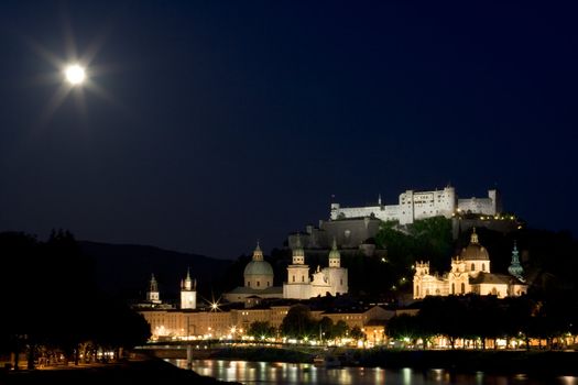 Old town and fortress on the hill in Salzburg at night