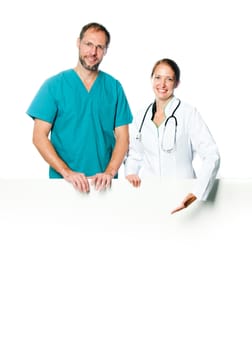 friendly doctors holding  a white blank board