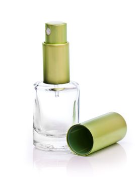 empty green glass perfume bottle on a white backgroung
