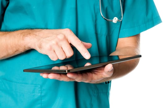 Hands of doctor using tablet computer