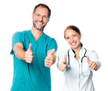 Friendly doctors with thumbs up - isolated over white