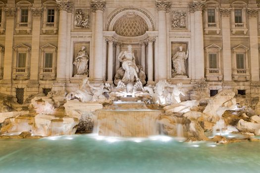 Famous Italy Rome landmark the biggest baroque sculptural aqueduct fountain di trevi by Nicola Salvi lighted in twilight