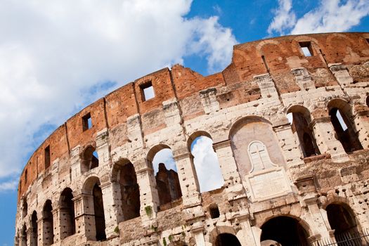 Arched antique facade of ancient architectural European landmark gladiatorial amphitheatre
Colosseum in Rome Italy on the blue sky background