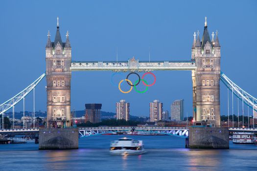 Landmark Tower bridge on river Thames illuminated and decorated with symbol 5color rings  before Olympic games  in London 2012 Great Britain at twilight