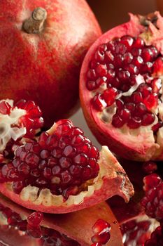 Pomegranate slices and seeds on silver salver