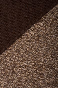 Knitted textile from two dark brown and speckled patterns Backgrounds Abstract