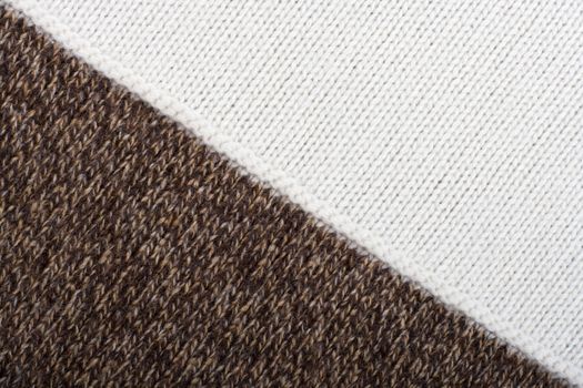 Knitted textile from two brown speckled and white patterns Backgrounds Abstract